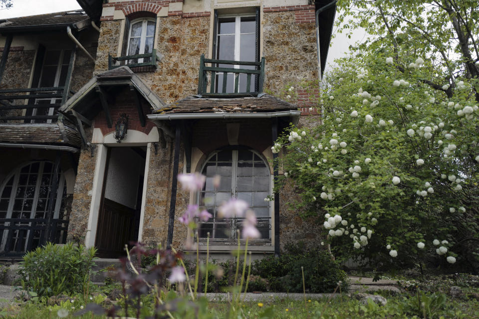 The front door of the 120 sq. meters (1,300 sq. feet) stone house where the Nobel-winning scientist couple Marie Sklodowska-Curie and Pierre Curie spent vacation and weekends from 1904-1906 in Saint-Remy-les-Chevreuse, on the south-west outskirts of Paris, France, Wednesday, May 12, 2021. Poland's prime minister Mateusz Morawiecki says he's given instructions for the government to buy 790,000 euro house in France, and said on Twitter Tuesday that the house, is a "part of Poland's history." (AP Photo/Francois Mori)