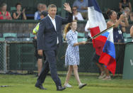 Tennis Hall of Fame inductee Yevgeny Kafelnikov, of Russia, waves to the crowd as he is introduced during ceremonies at the International Tennis Hall of Fame, Saturday, July 20, 2019, in Newport, R.I. (AP Photo/Stew Milne)