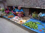 Women sell vegetables, among them yongchak or stinky beans. A favourite ingredient of Manipuri dishes, these oversize legumes are also used in Thai cooking.