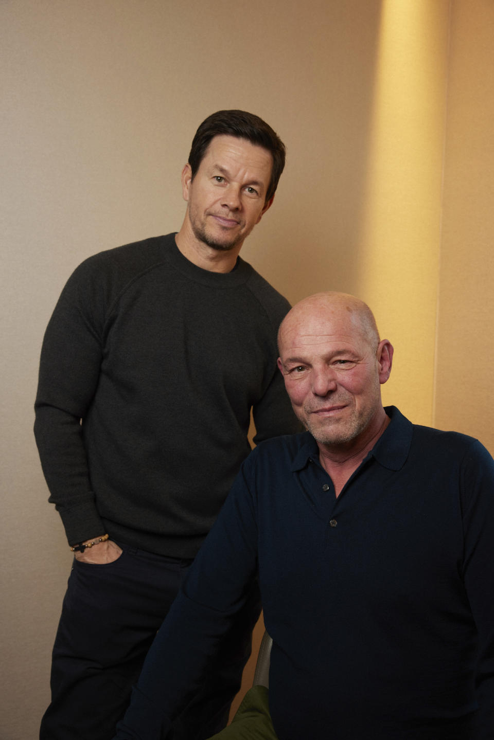 Director Simon Cellan Jones, right, poses with actor Mark Wahlberg in New York on Dec. 9, 2023, to promote their film "The Family Plan." (Photo by Matt Licari/Invision/AP)