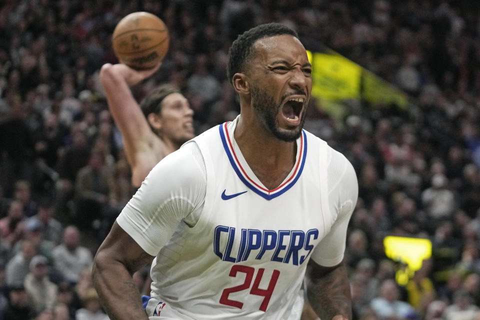 Los Angeles Clippers guard Norman Powell (24) reacts after being fouled during the second half of the team's NBA basketball game against the Utah Jazz on Friday, Oct. 27, 2023, in Salt Lake City. (AP Photo/Rick Bowmer)