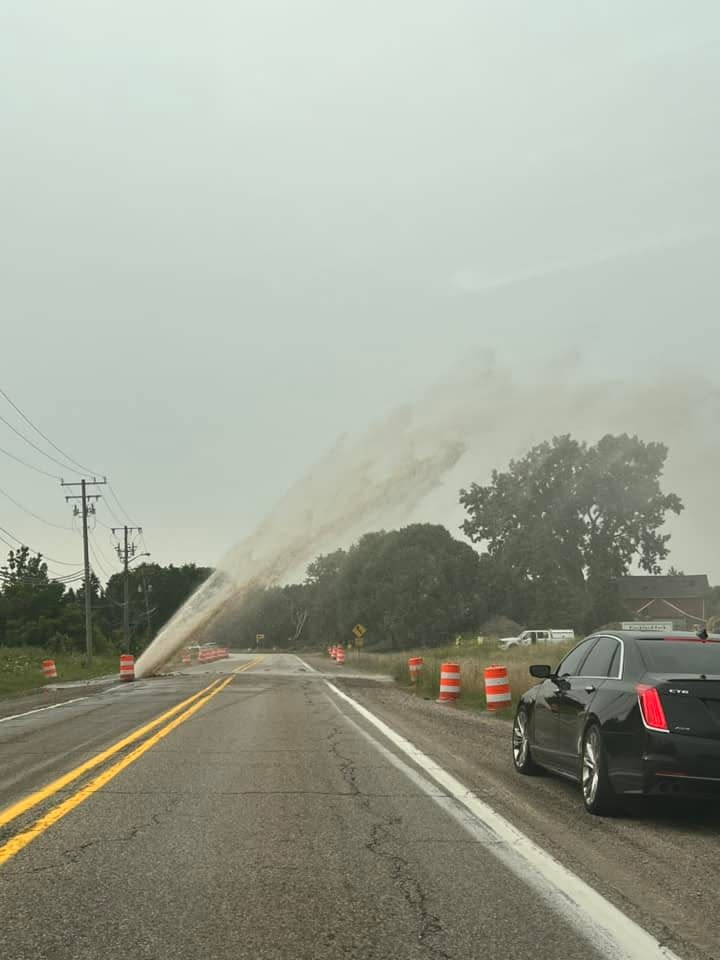 A water main break is pictured near the intersection of 22 Mile Road and Romeo Plank on Tuesday, Aug. 1, 2023.