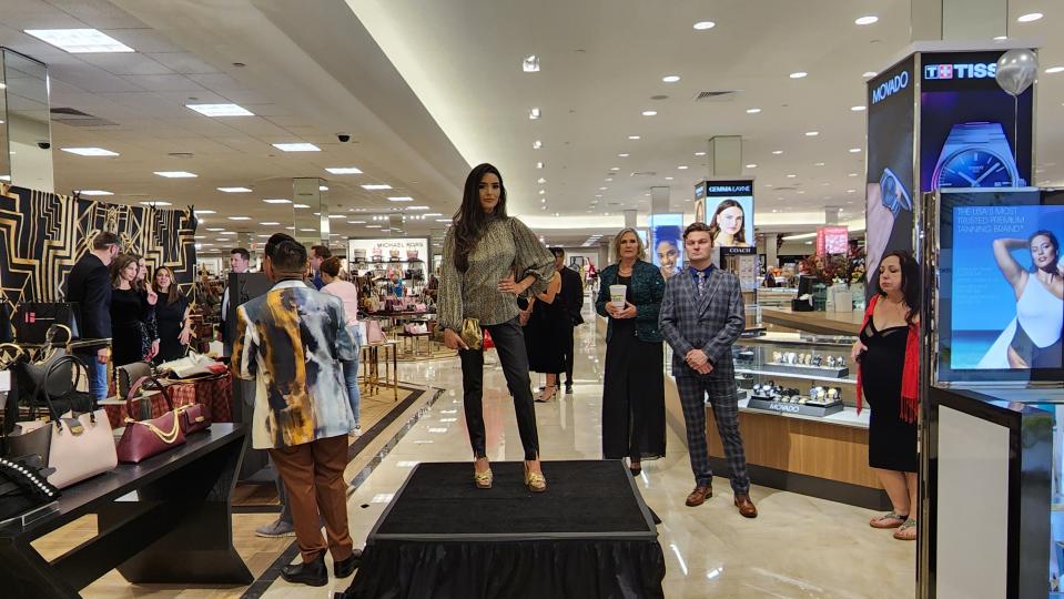 The crowd watches as models show off Dillard's fashions Wednesday night  at its  Grand Opening Fashion Gala at the Westgate Mall in Amarillo.