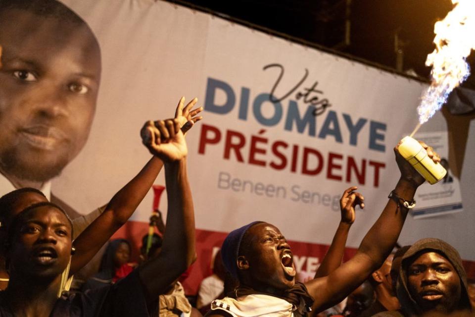 Supporters of opposition presidential candidate Bassirou Diomaye Faye and opposition leader Ousmane Sonko celebrate at Faye’s coalition headquarters as the votes are counted, in Dakar, Senegal, on March 24, 2024.<span class="copyright">Marco Longari—AFP/Getty Images</span>