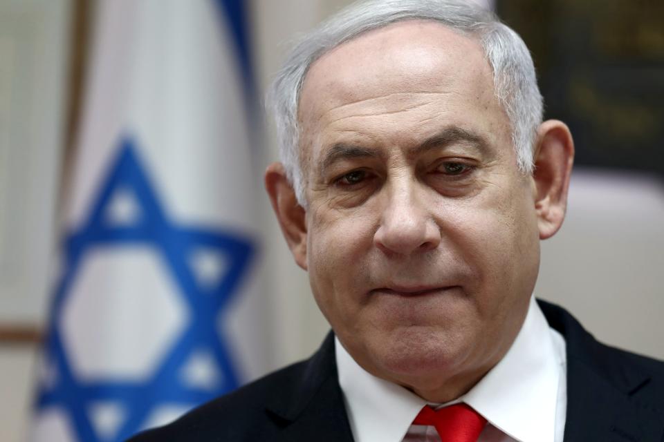 FILE PHOTO: Israeli Prime Minister Benjamin Netanyahu looks on as he chairs the weekly cabinet meeting at his Jerusalem office December 15, 2019. Gali Tibbon/Pool via REUTERS