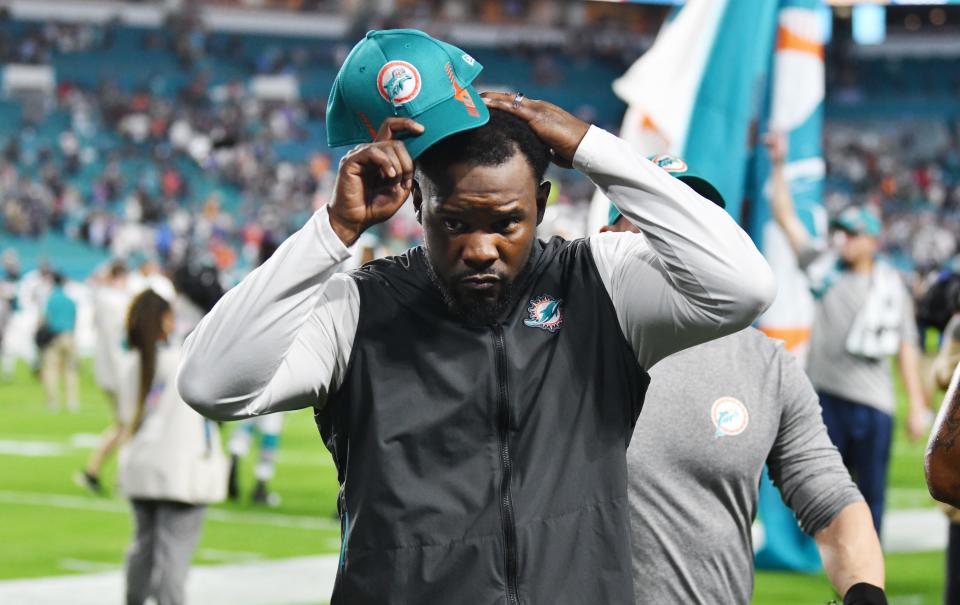 Brian Flores walks off the field at Hard Rock Stadium Sunday for the last time as the Miami Dolphins' head coach.