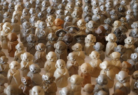 Small statues of Jizo, a Buddhist deity, for victims of the March 11, 2011 earthquake and tsunami, are seen in Soma, Fukushima Prefecture, Japan, July 31, 2015. REUTERS/Toru Hanai