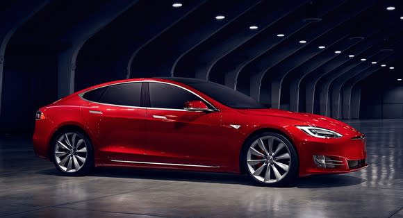 A red Tesla Model S sedan.