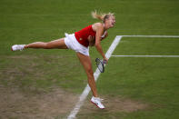 LONDON, ENGLAND - JULY 29: Maria Sharapova of Russia serves during the Women's Singles Tennis match against Shahar Peer of Israel on Day 2 of the London 2012 Olympic Games at the All England Lawn Tennis and Croquet Club in Wimbledon on July 29, 2012 in London, England. (Photo by Clive Brunskill/Getty Images)