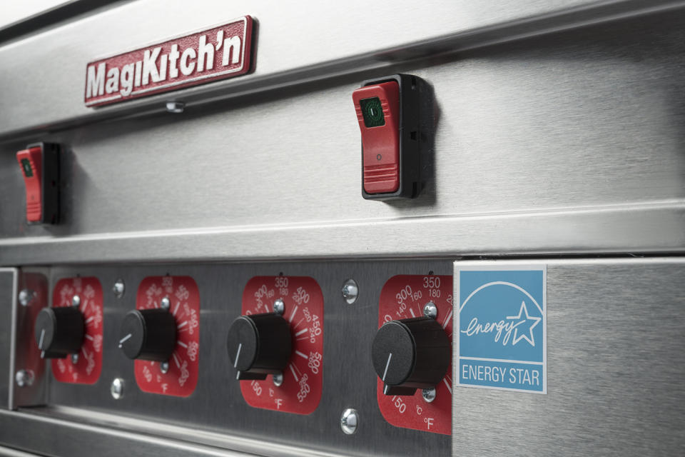 Silver and red kitchen equipment labeled MagiKitch'n.