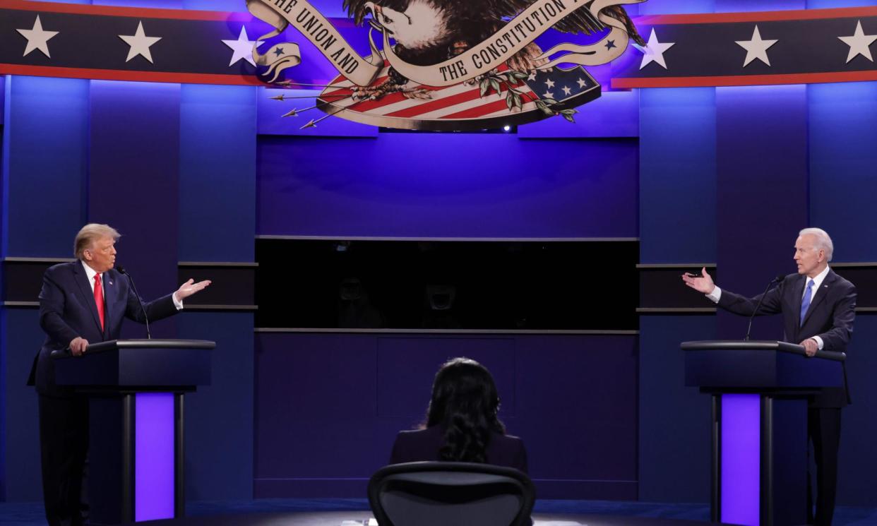 <span>Donald Trump and Joe Biden participate in the final presidential debate at Belmont University in Nashville, Tennessee, on 22 October 2020. </span><span>Photograph: Chip Somodevilla/AFP/Getty Images</span>