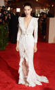 <p>Rooney Mara embodied the punk theme of 2013's Met Gala in a plunging white Givenchy gown with thigh-high split.</p>