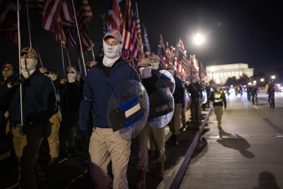 Members of Patriot Front  are pictured marching in Washington DC in December 2021 (Getty Images)