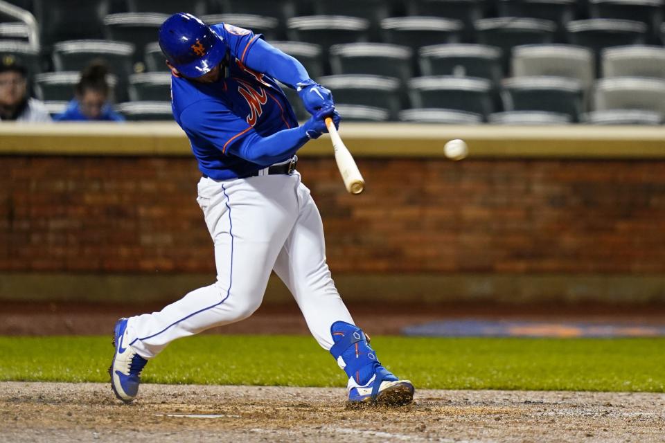 New York Mets' Francisco Alvarez hits a double during the eighth inning in the second baseball game of a doubleheader against the Washington Nationals, Tuesday, Oct. 4, 2022, in New York. The Mets won 8-0. (AP Photo/Frank Franklin II)