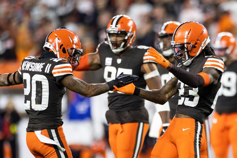 Cleveland Browns cornerbacks Greg Newsome II (20) and Martin Emerson Jr. (23) celebrate during the win over the Cincinnati Bengals at FirstEnergy Stadium.