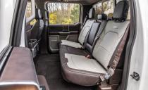 <p>Even four years in, the interior of this truck looks great, with rich detailing like the crosshatch-brushed-metal-look trim around the HVAC vents, genuine ash wood panels behind the door handles that seem as if they were sourced from the Gibson guitar factory, and distressed and mottled leather on the seatbacks.</p>