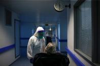 A nurse talks with a patient in the COVID-19 ward of Cascais Hospital amid the coronavirus disease (COVID-19) pandemic in Cascais