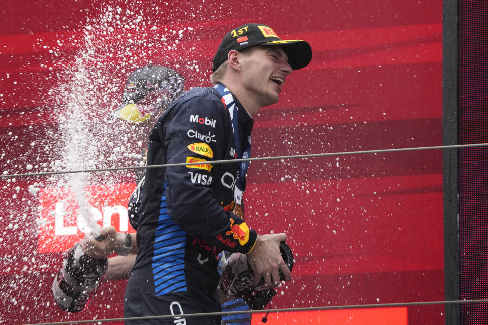 Red Bull driver Max Verstappen of the Netherlands celebrates on the podium after winning the Chinese Formula One Grand Prix at the Shanghai International Circuit, Shanghai, China, Sunday, April 21, 2024. (AP Photo/Andy Wong)