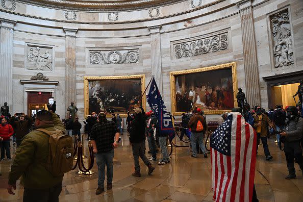 Supporters of US President Donald Trump enter the US Capitol's Rotunda on January 6, 2021, in Washington, DC. - Demonstrators breeched security and entered the Capitol as Congress debated the a 2020 presidential election Electoral Vote Certification. (Photo by Saul LOEB / AFP) (Photo by SAUL LOEB/AFP via Getty Images)