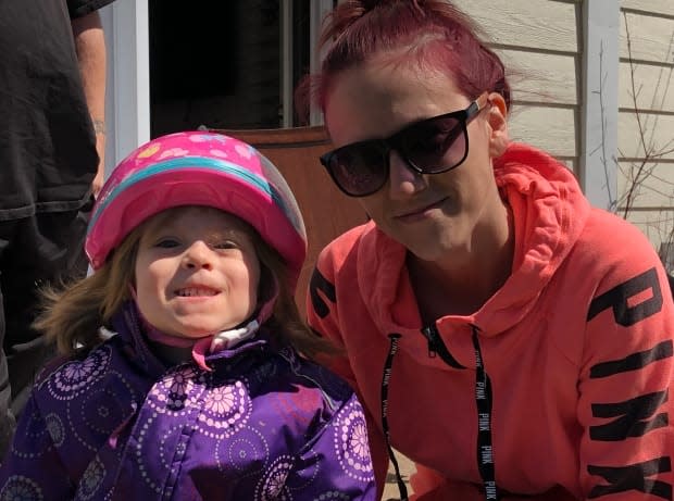 Natalie Chiasson-Frigault and her four-year-old daughter, Kaylee, live next door to the new Community Hub. Chiasson-Frigault hopes the new space will offer activities for the many children in the neighbourhood. (Vanessa Blanch/CBC - image credit)