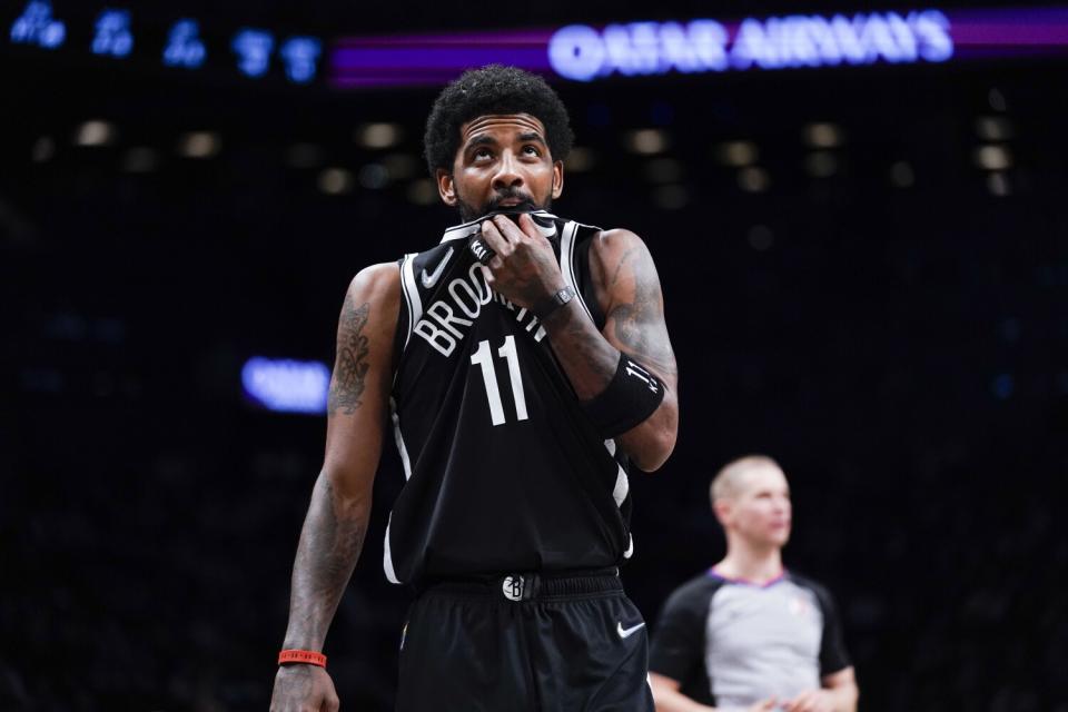 Kyrie Irving looks up at the scoreboard during a game between the Brooklyn Nets and Cleveland Cavaliers in April.