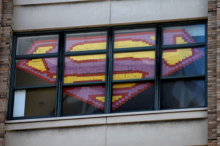 An image of the Superman Logo created with Post-it notes is seen in windows at 200 Hudson street in lower Manhattan, New York, May 18, 2016. REUTERS/Mike Segar