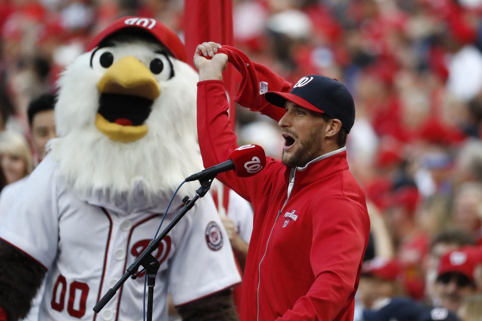 WASHINGTON, DC - OCTOBER 7: Quarterback Kirk Cousins of the Washington Redskins yells Play Ball prior to game one of the National League Division Series between the Los Angeles Dodgers and the Washington Nationals at Nationals Park on October 7, 2016 in Washington, DC. (Photo by Alex Brandon/AP - Pool /Getty Images)