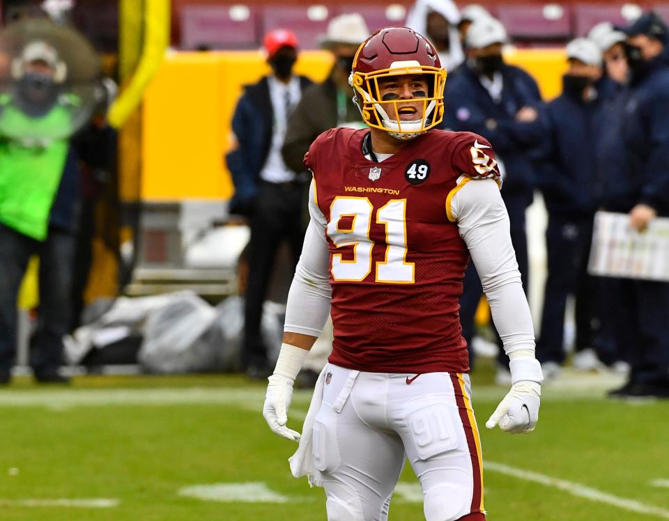 Washington Football Team defensive end Ryan Kerrigan (91) reacts after recording a sack against the Dallas Cowboys during the second half at FedExField.