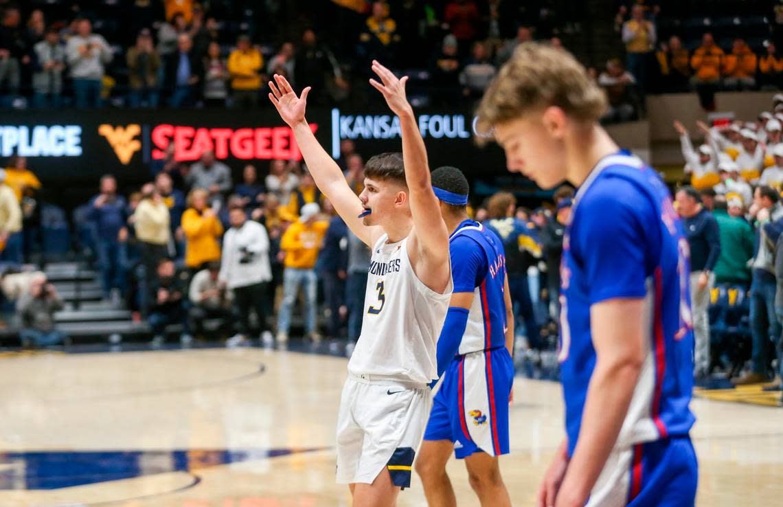 Kerr Kriisa (center) played last season at West Virginia after beginning his college career by playing three seasons at Arizona.