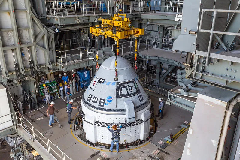 The Starliner spacecraft being lowered into place atop its United Launch Alliance Atlas 5 rocket at launch complex 41 at the Cape Canaveral Space Force Station. / Credit: ULA