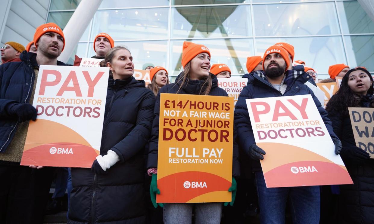 <span>Junior doctors and members of the British Medical Association picketing outside University College Hospital in London in December.</span><span>Photograph: James Manning/PA</span>