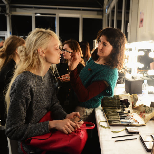 Make-up artists behind-the-scenes at the John Rocha show © Getty