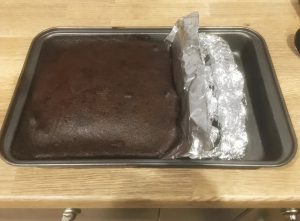 brownies baked in a large pan that's been sectioned off with tin foil