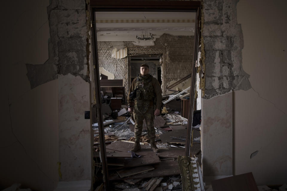 Azov battalion Kraken unit commander Konstantin Nemichev poses for photo inside the regional administration building, heavily damaged after a Russian attack last month, in Kharkiv, Ukraine, Thursday, April 21, 2022. (AP Photo/Felipe Dana)