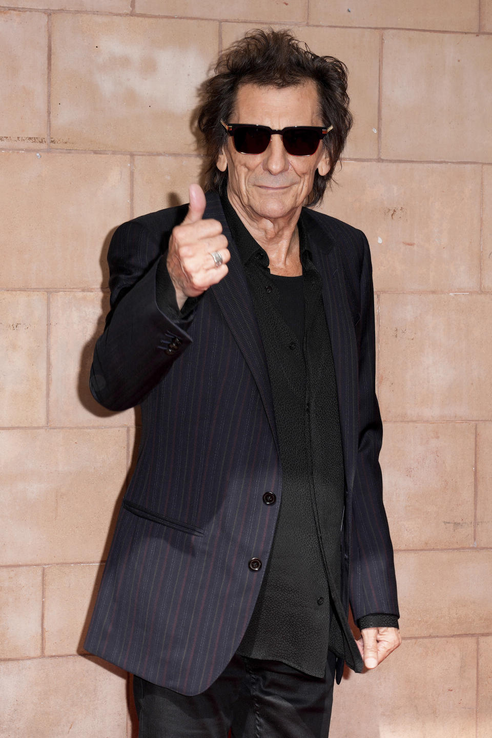 Ronnie Wood poses for photographers upon arrival at the Rolling Stones Hackney Diamonds launch event on Wednesday, Sept. 6, 2023 in London. (Scott Garfitt/Invision/AP)