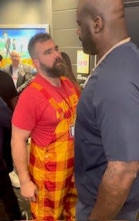 Jason Kelce speaks with Shaquille O'Neal outside Taylor Swift's suite at the Super Bowl.