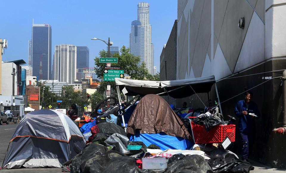 Belongings of the homeless crowd a downtown Los Angeles sidewalk in Skid Row.