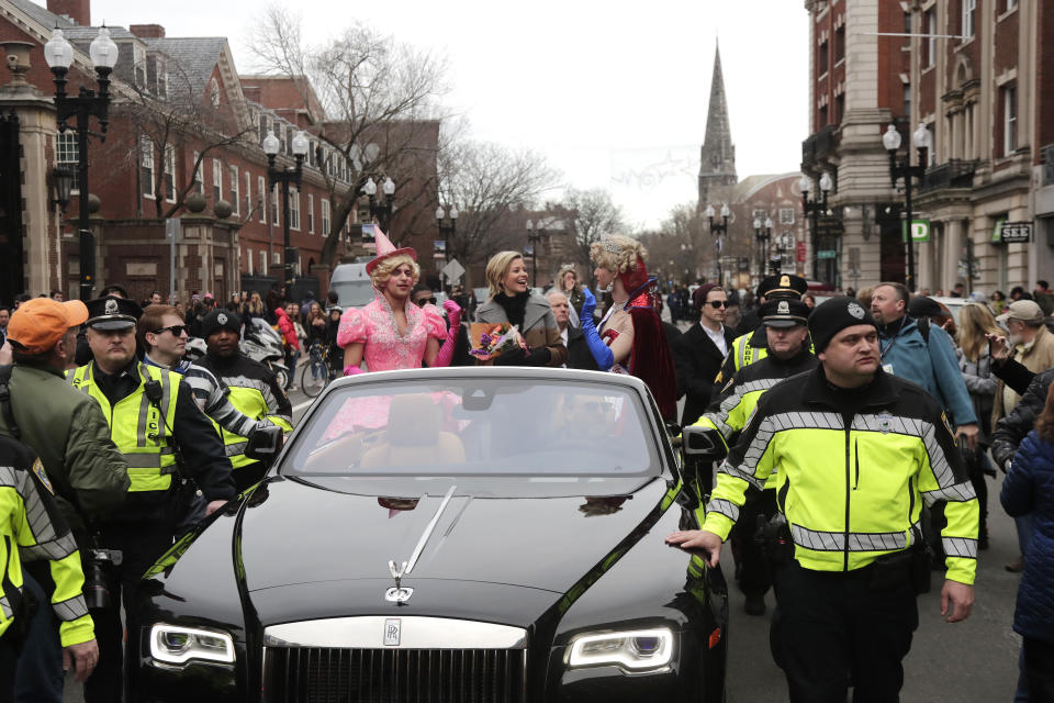 Actor and director Elizabeth Banks, center, is paraded through Harvard Square as she is honored as the 2020 Woman of the Year by Harvard University's Hasty Pudding Theatricals, Friday, Jan. 31, 2020, in Cambridge, Mass. (AP Photo/Elise Amendola)