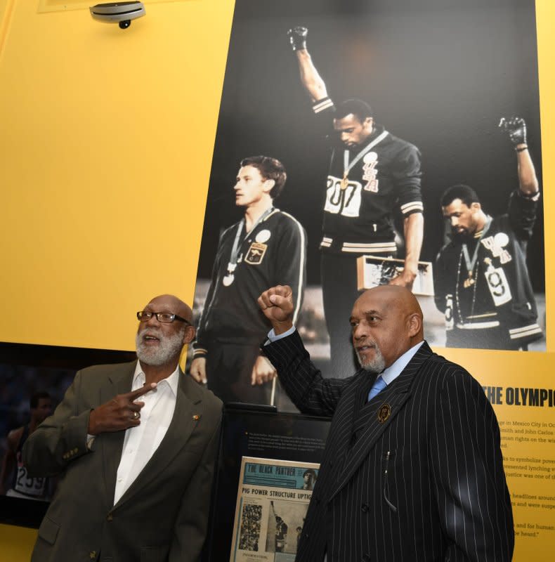 Olympic athlete Tommie Smith (R) and John Carlos, who raised their fists in a Black Power salute at the 1968 Olympics, recreate the protest at the Newseum on April 17, 2018, in Washington, D.C. File Photo by Mike Theiler/UPI