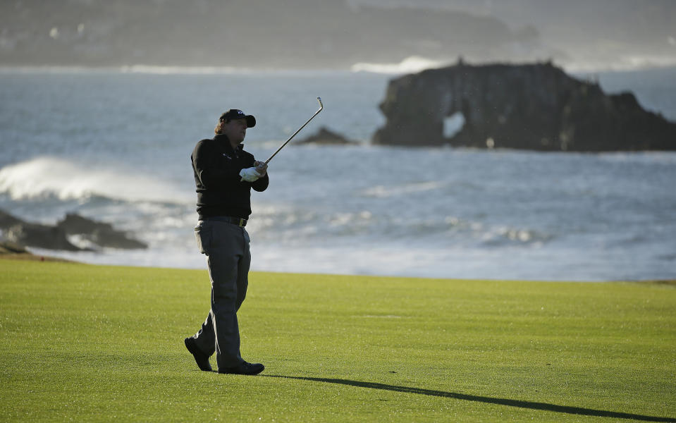 Phil Mickelson hits from the 18th fairway of the Pebble Beach Golf Links during the final round of the AT&T Pebble Beach Pro-Am golf tournament Monday, Feb. 11, 2019, in Pebble Beach, Calif. Mickelson won the tournament after finishing at 19-under-par. (AP Photo/Eric Risberg)