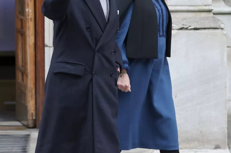 Hand-in-hand with Camilla, Charles waved for the camera as he left The London Clinic in January after prostate treatment