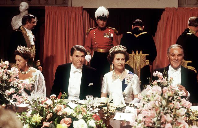 <p>Tim Graham Photo Library via Getty</p> President Ronald Reagan and Queen Elizabeth