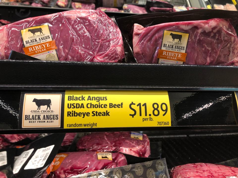 ribeye steaks on a shelf  at aldi