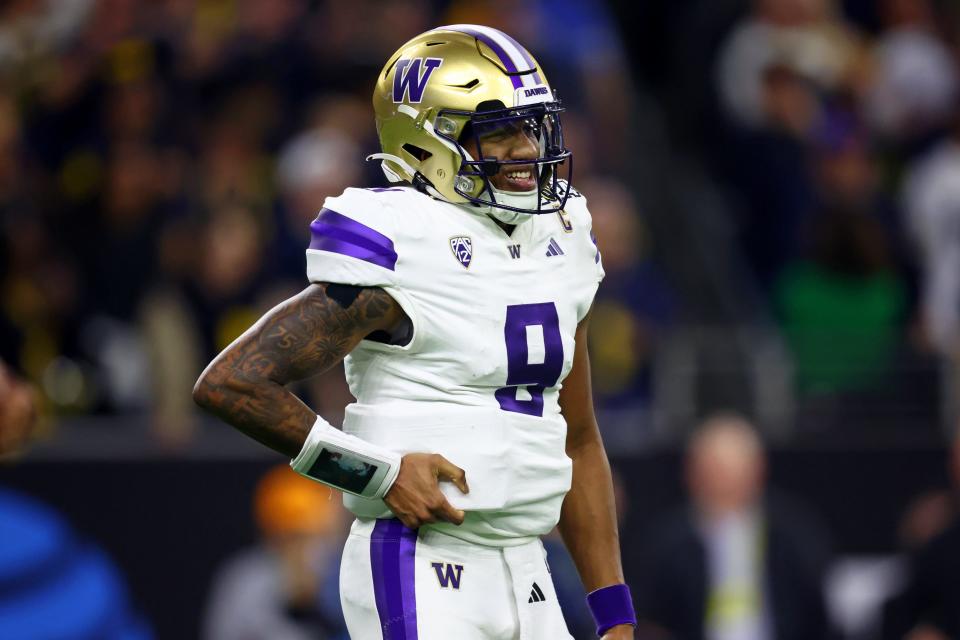 Washington quarterback Michael Penix Jr. reacts after a play against Michigan during the fourth quarter of the 2024 College Football Playoff national championship game.