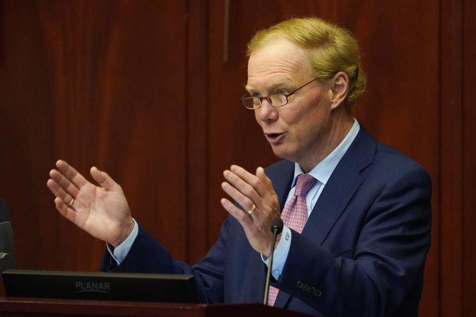 Joseph Reid, McGuireWoods, representing Dominion, right, speaks during a meeting of the State Corporations Commission Tuesday May 17, 2022, in Richmond, Va. The commission was reviewing an application for Dominion's offshore wind project. (AP Photo/Steve Helber)