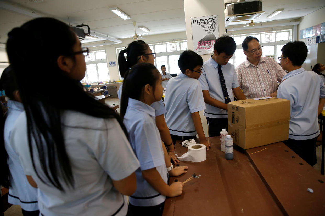 A teacher supervises students during an enrichment class at a Singapore secondary school. Picture taken before the COVID-19 pandemic. 