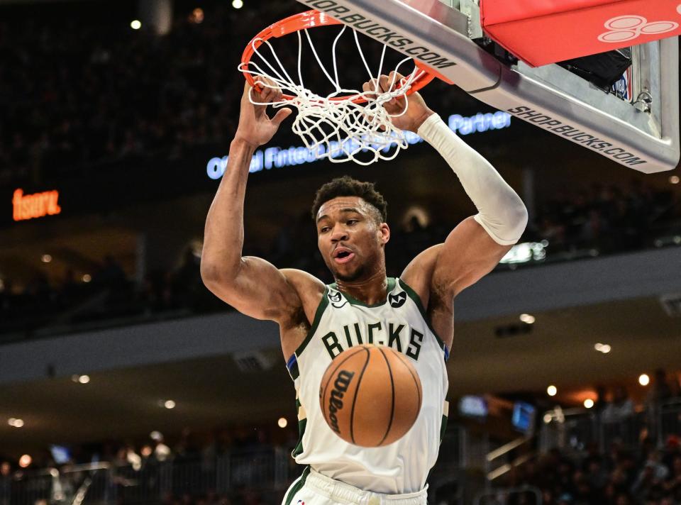 Bucks forward Giannis Antetokounmpo throws down a dunk during the second quarter of a game against the Raptors at Fiserv Forum in Milwaukee on March 19, 2023.