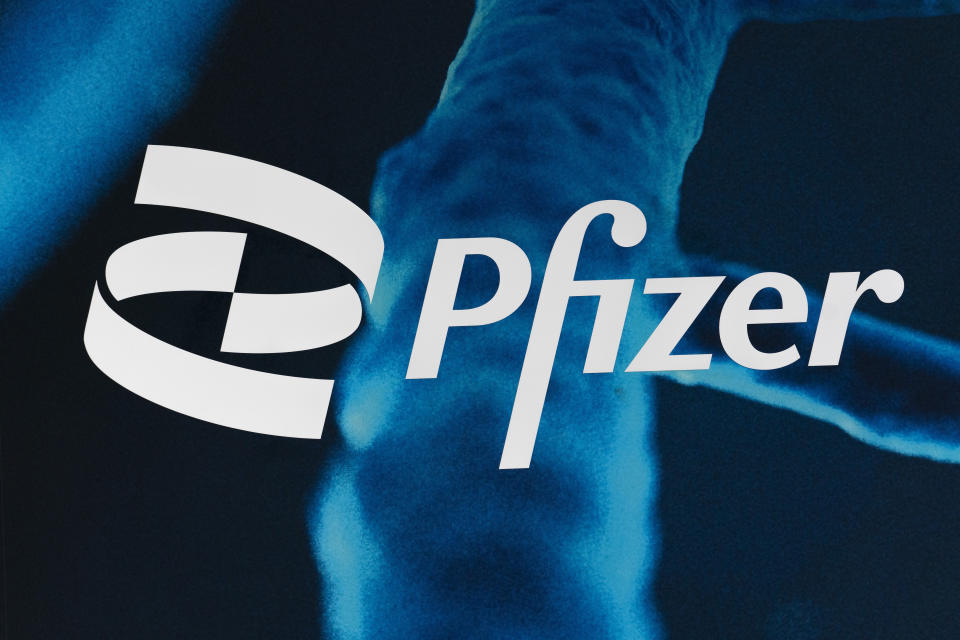 The Pfizer logo is displayed at the company's headquarters, Friday, Feb. 5, 2021, in New York. Pfizer and BioNTech have pledged to deliver 2 billion doses of their COVID-19 vaccine to middle- and low-income countries over the next 18 months. The companies made the announcement, Friday, May 21, 2021 at a global health summit in Rome.(AP Photo/Mark Lennihan)