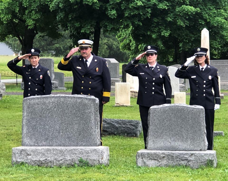 Cheshire firefighters pay their respects to veterans at Pine Bank Cemetery.