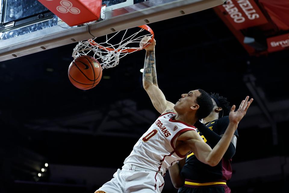 Kobe Johnson (0) of the USC Trojans dunks during a game between the USC Trojans and the Arizona State Sun Devils at Galen Center on March 4, 2023, in Los Angeles.